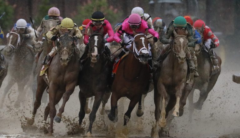 Luis Saez riding Maximum Security, second from right, goes around turn four with Flavien Prat riding Country House, left, Tyler Gaffalione riding War of Will and John Velazquez riding Code of Honor, right, during the 145th running of the Kentucky Derby horse race at Churchill Downs Saturday, May 4, 2019, in Louisville, Ky. 