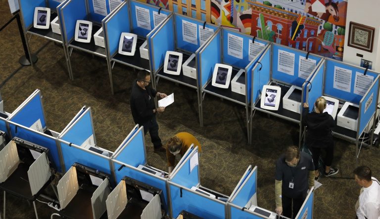 Voters fill out their ballots at the Denver Elections Division Tuesday, May 7, 2019, in Denver. 