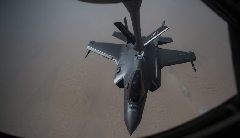 In this Sunday, May 12, 2019 photo released by the U.S. Air Force, an F-35A Lightning II receives fuel from a KC-135 Stratotanker from the 28th Expeditionary Aerial Refueling Squadron, at an undisclosed location. The White House ordered the USS Abraham Lincoln aircraft carrier strike group and B-52 bombers to the Persian Gulf region on May 4. 