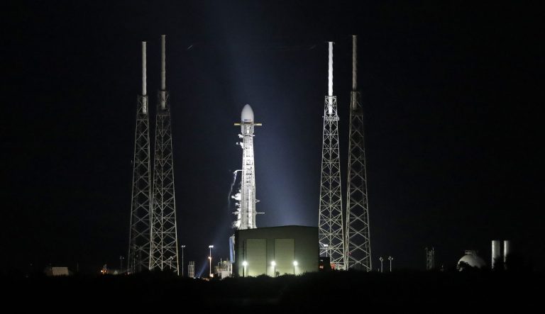A Falcon 9 SpaceX rocket, with a payload of 60 satellites for SpaceX's Starlink broadband network, is seen moments after the launch was scrubbed at space launch complex 40 at the Cape Canaveral Air Force Station in Cape Canaveral, Fla., Wednesday, May 15, 2019. 