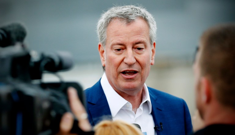 Democratic presidential candidate New York Mayor Bill de Blasio speaks to reporters.