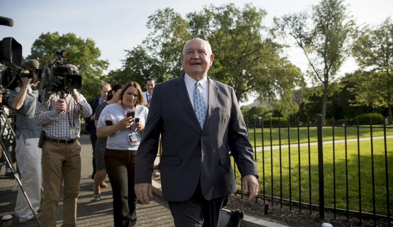 Agriculture Secretary Sonny Perdue laughs with a reporter on the North Lawn of the White House in Washington, Thursday, May 23, 2019.