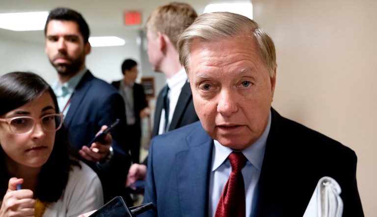Senate Judiciary Committee Chairman Lindsey Graham, R-S.C., is questioned by reporters at the Capitol in Washington.