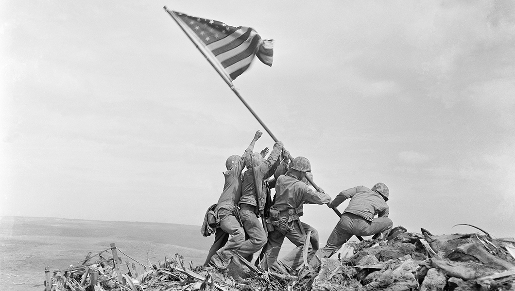 In this Feb 23, 1945, file photo, U.S. Marines of the 28th Regiment, 5th Division, raise the American flag atop Mt. Suribachi, Iwo Jima, Japan.