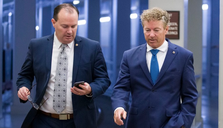Sen. Mike Lee, R-Utah, and Sen. Rand Paul, R-Ky., walk to a vote on Capitol Hill in Washington.
