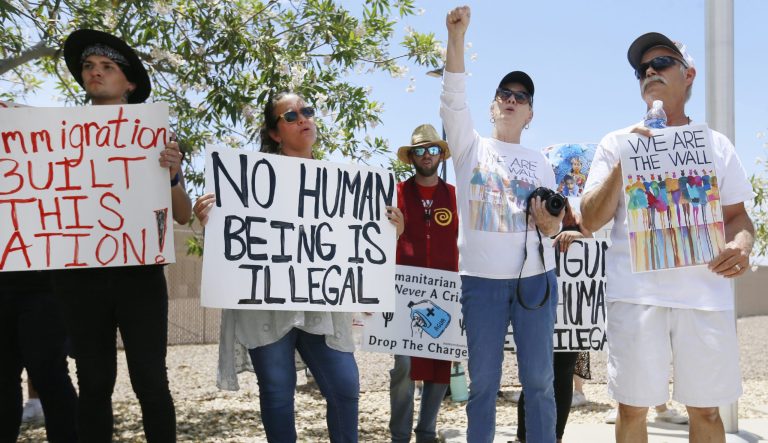 Protesters gather at the front of the Clint Border Patrol station to hear U.S. and Texas lawmakers talk about what they thought of the area facilities they toured Monday, July 1, at the Border Patrol station in Clint. 