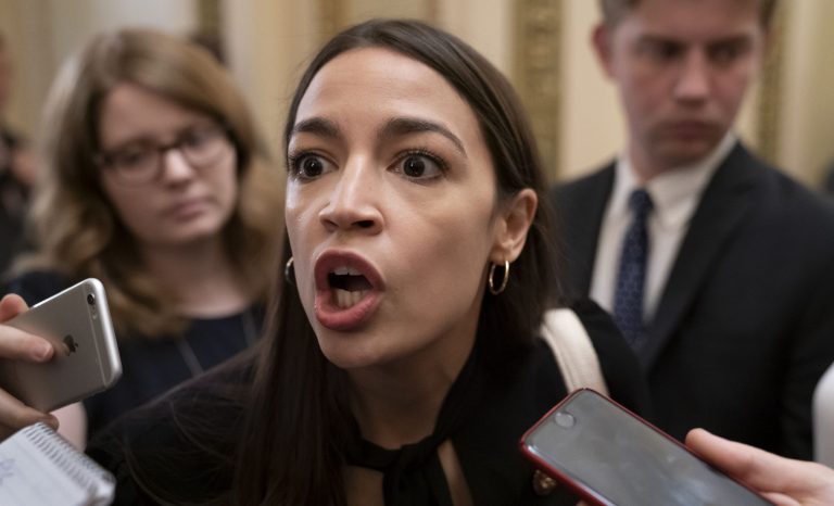 Rep. Alexandria Ocasio-Cortez, D-N.Y., responds to reporters as she arrives for votes in the House, at the Capitol in Washington, Thursday, July 18, 2019. 