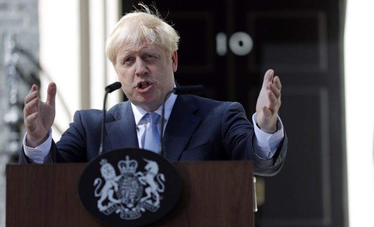 Britain's new Prime Minister Boris Johnson gestures as he speaks outside 10 Downing Street, London, Wednesday, July 24, 2019. 