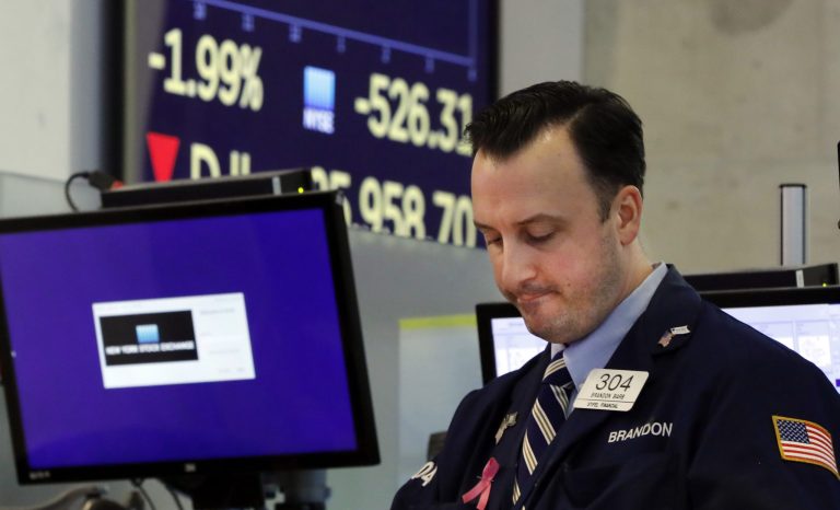 Trader Brandon Barb works on the floor of the New York Stock Exchange, Monday, Aug. 5, 2019. U.S. stocks nosedived in early trading on Wall Street Monday as China's currency fell sharply and stoked fears that the trade war between the world's two largest economies would continue escalating. 