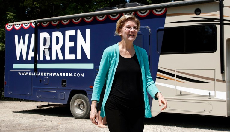Democratic presidential candidate Sen. Elizabeth Warren, D-Massachusetts, exits a motor home as she visits a park along the Des Moines River on Friday in Humboldt, Iowa. 