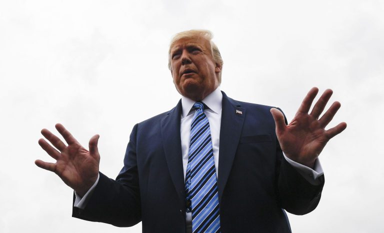 President Donald Trump talks to reporters at Morristown Municipal Airport in Morristown, N.J., Tuesday, Aug. 13, 2019.  