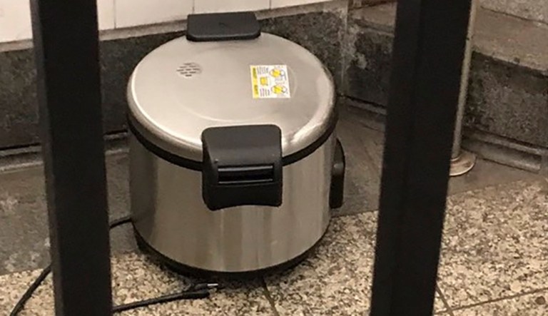 This photo provided by NYPD shows a suspicious object which looks like a pressure cooker or electric crockpot on the floor of the New York City Subway platform on Friday in New York.