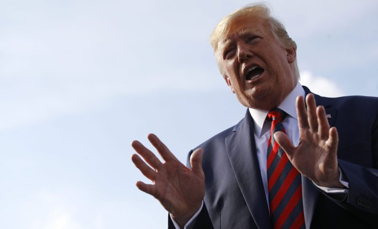President Donald Trump speaks with reporters before boarding Air Force One at Morristown Municipal Airport in Morristown, N.J., Sunday, Aug. 18, 2019, en route to Andrews Air Force Base, Md. 
