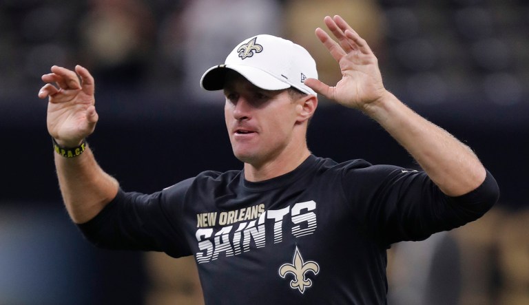 New Orleans Saints quarterback Drew Brees warms up before an NFL football game.