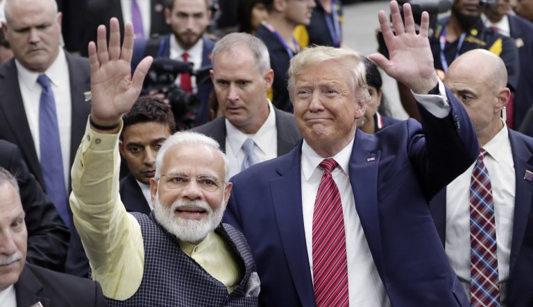 India Prime Minister Narendra Modi and President Trump walk the perimeter of the arena floor to greet attendants after Modi's speech during the "Howdy Modi" event Sunday, September 22, 2019, at NRG Stadium in Houston. 