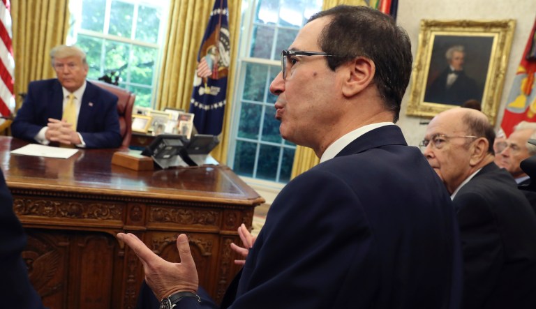 Treasury Secretary Steven Mnuchin speaks as Commerce Secretary Wilbur Ross, right, listens with President Donald Trump during their meeting with Vice Premier Liu He in the Oval Office of the White House in Washington, Friday, Oct. 11, 2019. 