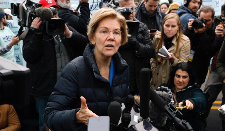 Democratic presidential candidate Sen. Elizabeth Warren speaks to reporters before the Iowa Democratic Party's Liberty and Justice Celebration, Friday, Nov. 1, 2019, in Des Moines, Iowa.
