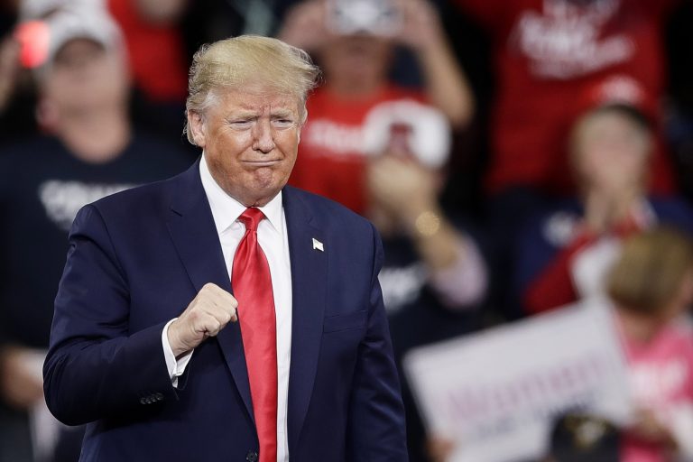 President Donald Trump gestures as he arrives at a campaign rally in Hershey, Pa., Tuesday, Dec. 10, 2019.