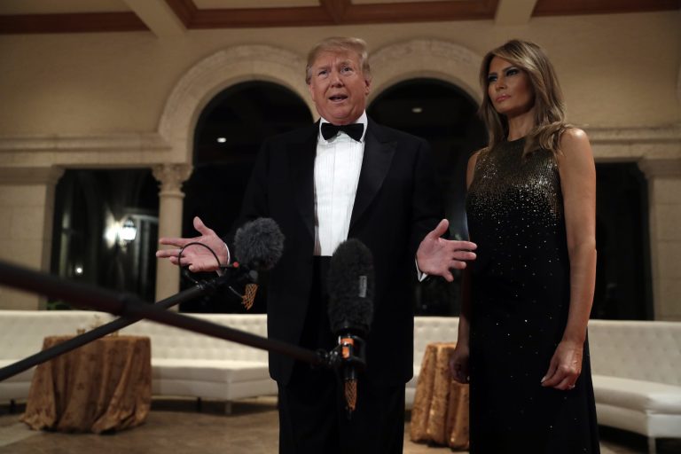 President Donald Trump, with wife Melania, speaks to the media from his Mar-a-Lago property in December.