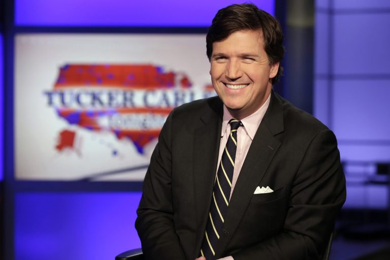 Tucker Carlson, host of "Tucker Carlson Tonight," poses for photos in a Fox News Channel studio, in New York, Thursday, March 2, 2107.