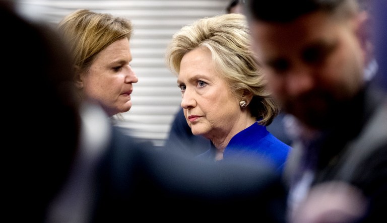 Democratic presidential candidate Hillary Clinton, right, speaks with Jennifer Palmieri, left, in Las Vegas.