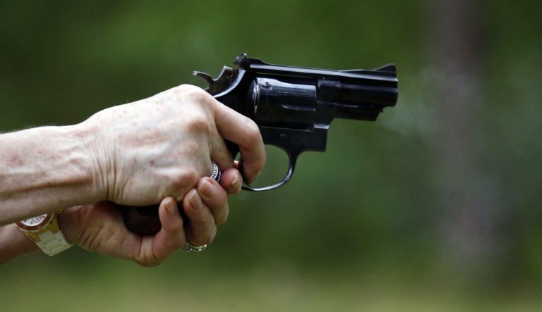 In this April 30, 2016 photograph, a participant properly holds and discharges a revolver during the live fire portion of a enhanced concealed carry class. 