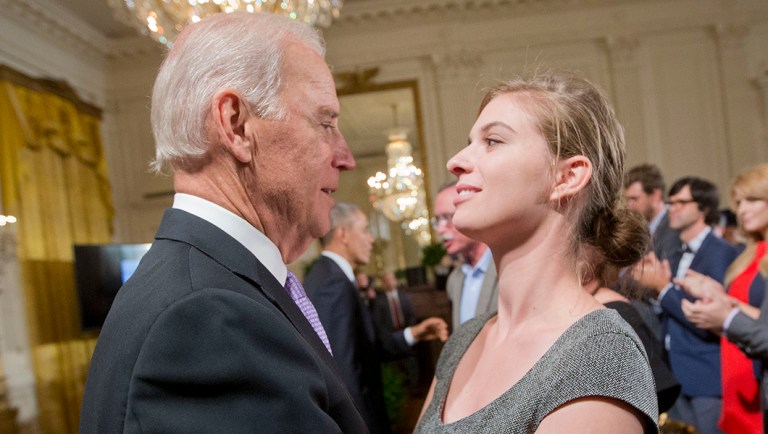 Vice President Joe Biden, left, hugs Lilly Jay, right, a sexual assault survivor, during a 'It's On Us' campaign.