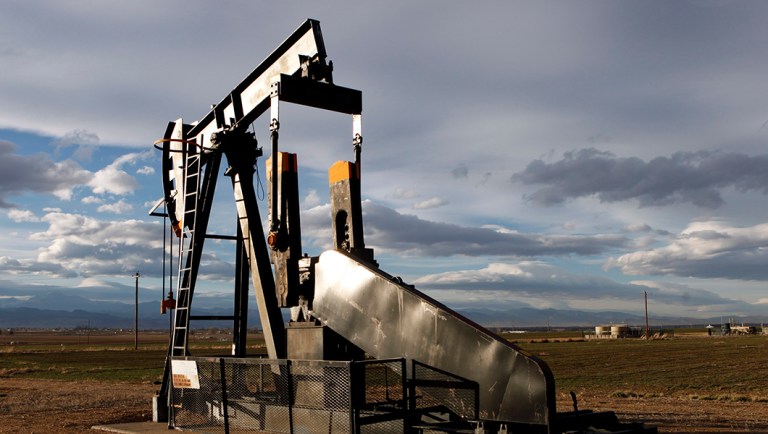 An oil pump jack in a field adjacent to a sub-division near Fredrick, Colo.