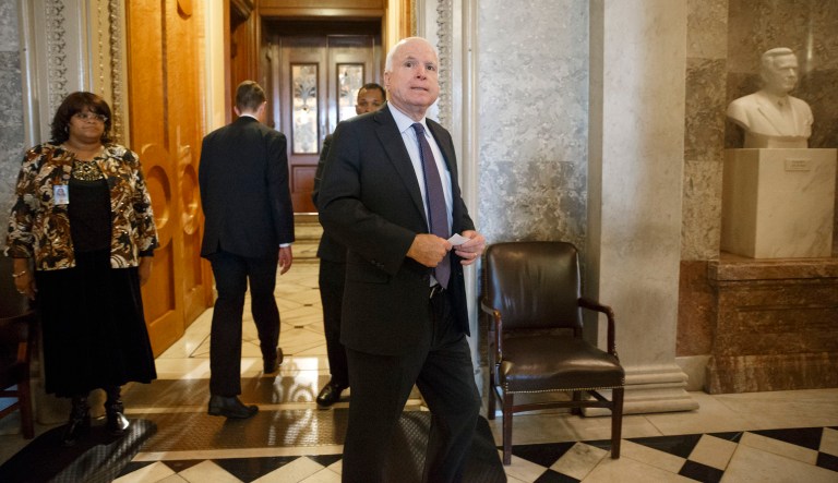 Sen. John McCain, R-Ariz., who's poised to become chairman of the Senate Armed Services Committee, leaves the chamber after he joined Sen. Dianne Feinstein, D-Calif., chairwoman of the Senate Intelligence Committee, to support the release of a report on the CIA's harsh interrogation techniques at secret overseas facilities after the 9/11 terror attacks, at the Capitol in Washington, Tuesday, Dec. 9, 2014. Some Republican leaders objected to the report's release and challenged its contention that harsh tactics didn't work, but McCain, tortured in Vietnam as a prisoner of war, welcomed the report and endorsed its findings.