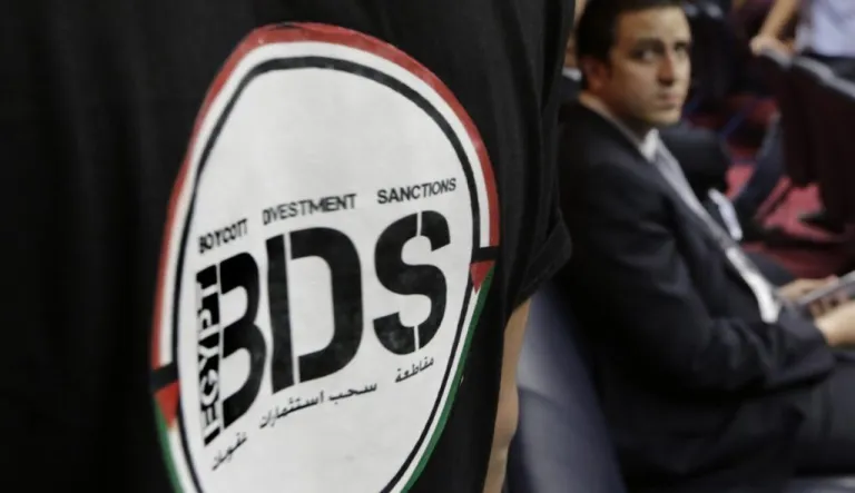 An Egyptian wears a T-shirt with the Boycott, Divestment and Sanctions (BDS) logo.