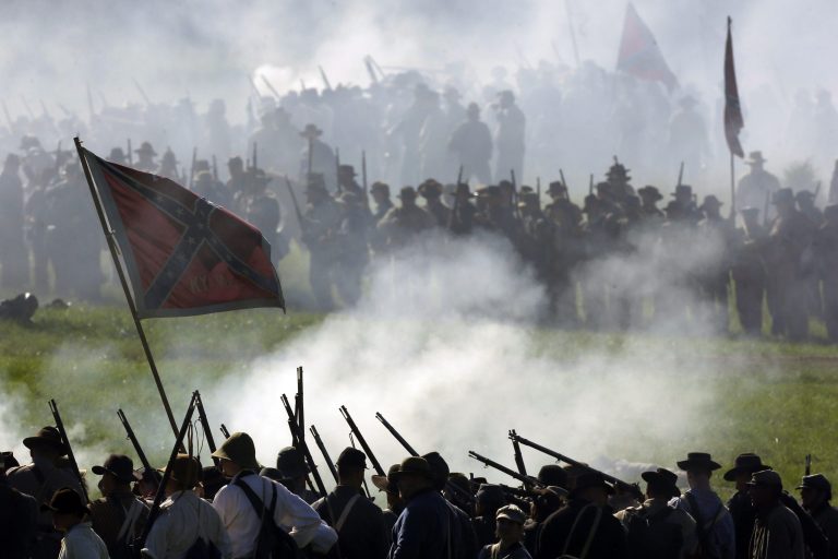 In this June 29, 2013 file photo, Confederate re-enactors take part in a demonstration of a battle during ongoing activities commemorating the 150th anniversary of the Battle of Gettysburg at Bushey Farm in Gettysburg, Pa.