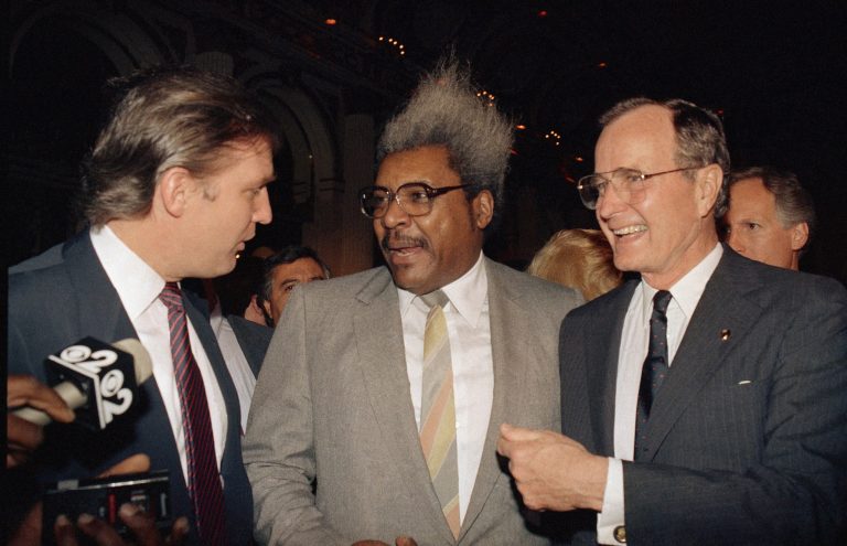 Former Vice President George Bush, right, shares a light moment with, from left, real estate developer and casino owner Donald Trump and fight promoter Don King, April 12, 1988 at New York's Plaza Hotel during a fundraiser for Bush by Trump.