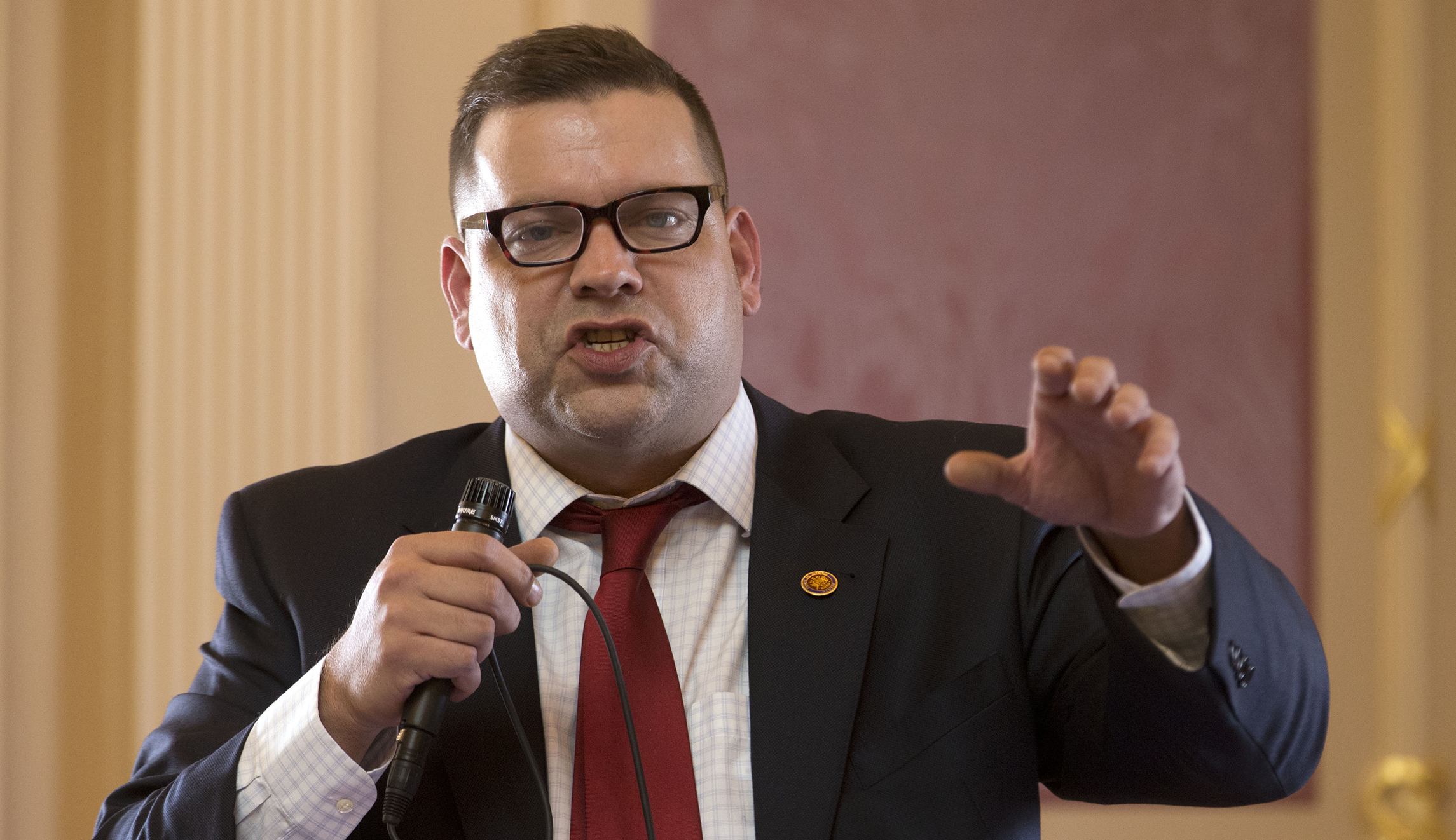 How does Tom Garrett’s alcoholism have anything to do with what’s really driving him out of office?