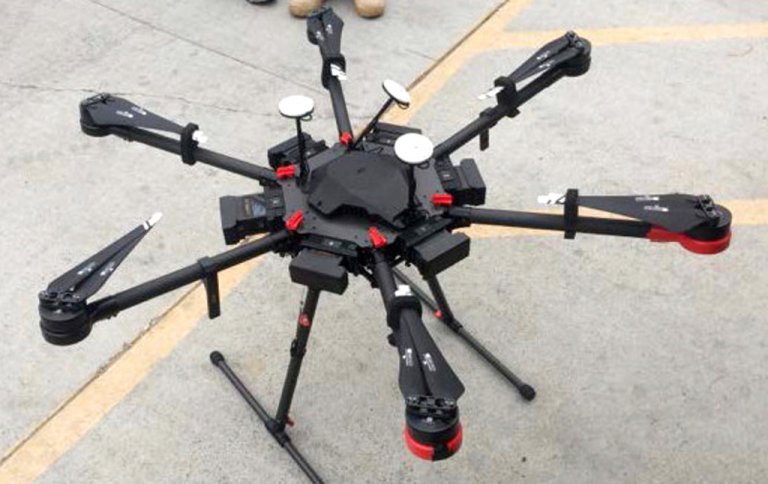This undated photo provided by the U.S. Border Patrol shows a 2-foot-high drone that a Border Patrol agent spotted swooping over the border fence on Tuesday, Aug. 8, 2017, near a San Diego border crossing. 
