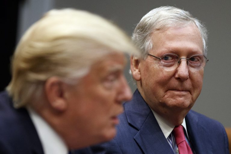 Senate Majority Leader Mitch McConnell, R-Ky., right, listens as President Donald Trump speaks during a meeting with Congressional leaders and administration officials on tax reform. Since impeachment, McConnell has seen his GOP support soar.