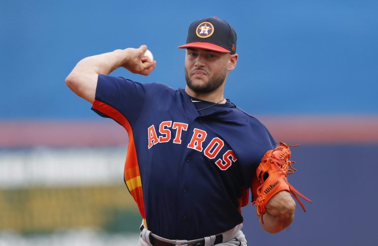 Houston Astros starting pitcher Lance McCullers Jr. warms up before the first inning of a spring training baseball game against the New York Mets, in Port St. Lucie, Fla. (AP Photo/John Bazemore)
