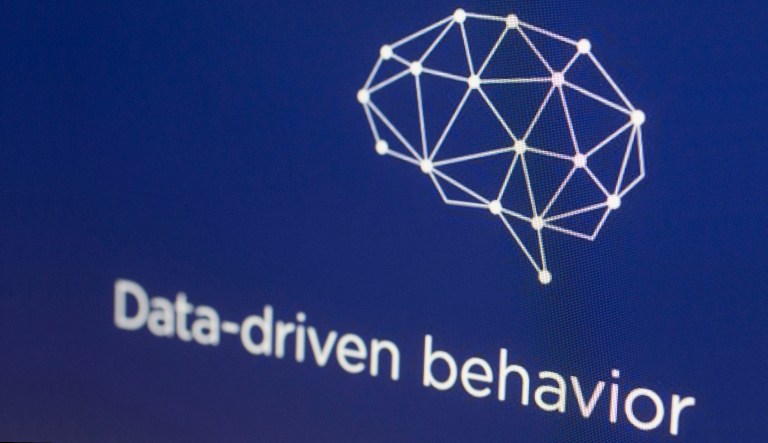 A graphic from the Cambridge Analytica website is displayed on a computer screen. 