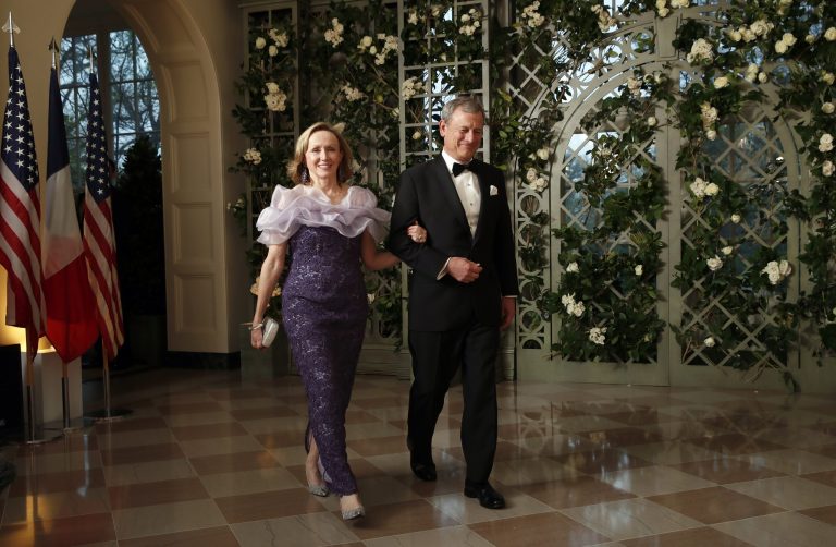 Supreme Court Justice Chief Justice John Roberts and his wife Jane Roberts arrive for a State Dinner with French President Emmanuel Macron and President Donald Trump at the White House, Tuesday, April 24, 2018, in Washington.