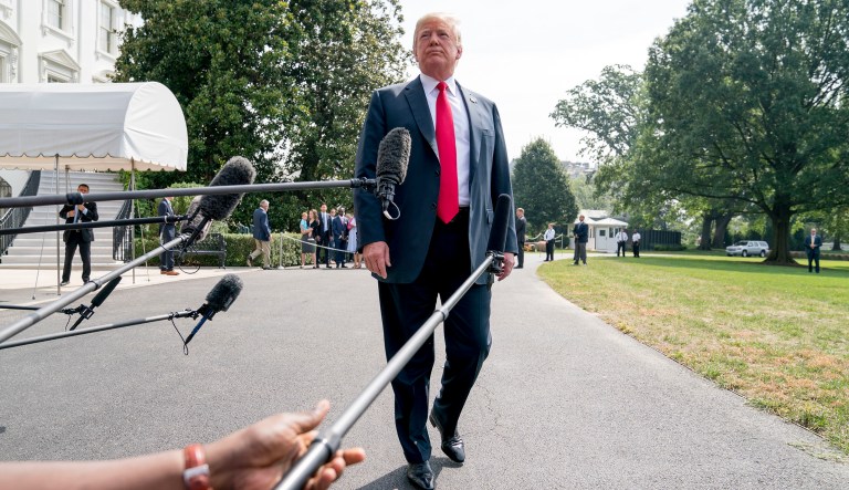 President Trump listens to a question from a member of the media before boarding Marine One on the South Lawn of the White House.