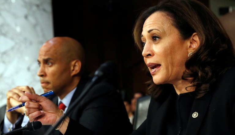 Sen. Cory Booker, D-N.J., listens as Sen. Kamala Harris, D-Calif., questions President Trump's Supreme Court nominee Brett Kavanaugh during the third day of Kavanaugh's Senate Judiciary Committee confirmation hearing. 