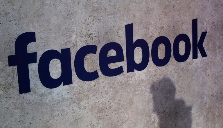 This Jan. 17, 2017, file photo shows a Facebook logo being displayed in a start-up companies gathering at Paris' Station F in Paris. Facebook is under fire again, accused of sharing private messages and other user information with other companies. The latest report from The New York Times is alarming even in light of previous disclosures about the social network's practices.