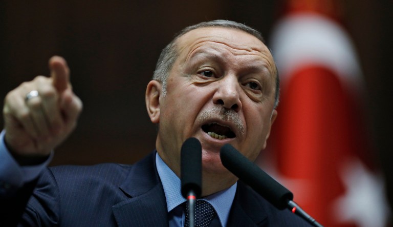 Turkey's President Recep Tayyip Erdogan gestures as he delivers a speech to MPs of his ruling Justice and Development Party (AKP) at the parliament in Ankara, Turkey, Tuesday, Jan. 8, 2019.