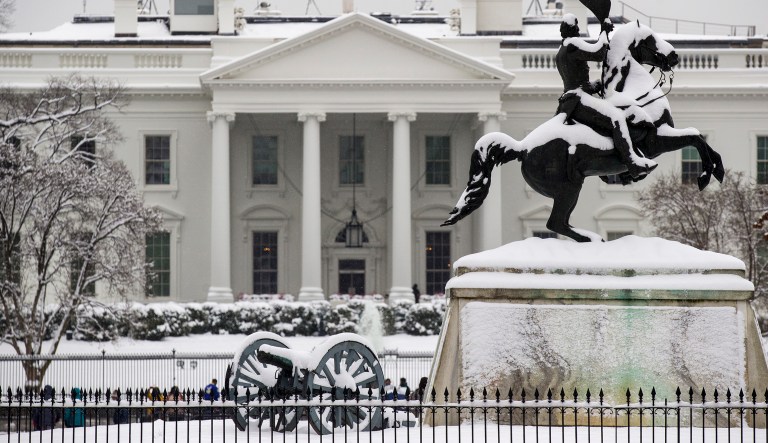 Snow blankets a statue of Andrew Jackson in Lafayette Square with the White House behind, as a winter storm arrives in the region, Sunday, Jan. 13, 2019, in Washington.