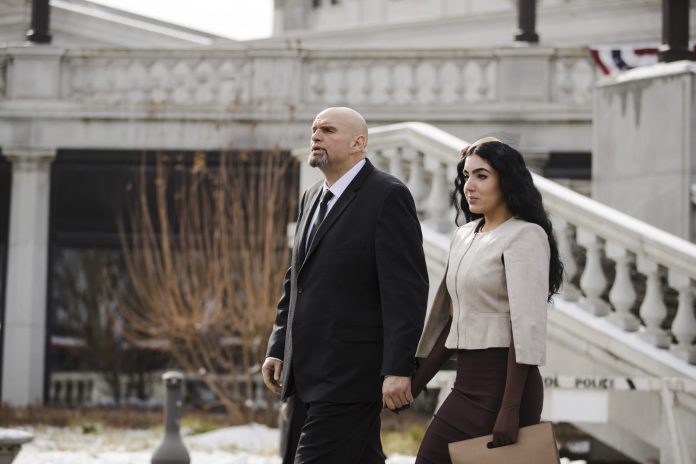 Pennsylvania Lt. Gov. John Fetterman and his wife Gisele walk to Pennsylvania Gov. Tom Wolf's inauguration, Tuesday, Jan. 15, 2019, at the state Capitol in Harrisburg, Pa. 