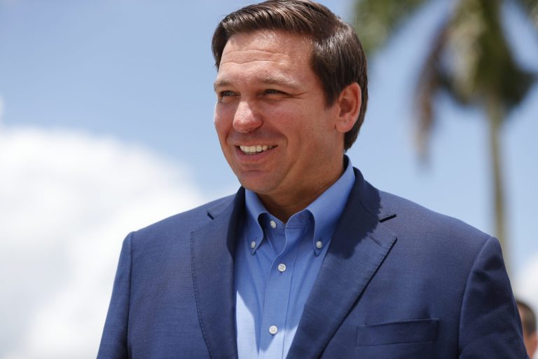 Florida Gov. Ron DeSantis smiles as he arrives at a news conference, Wednesday, Aug. 7, 2019, at Everglades Holiday Park in Fort Lauderdale, Fla.