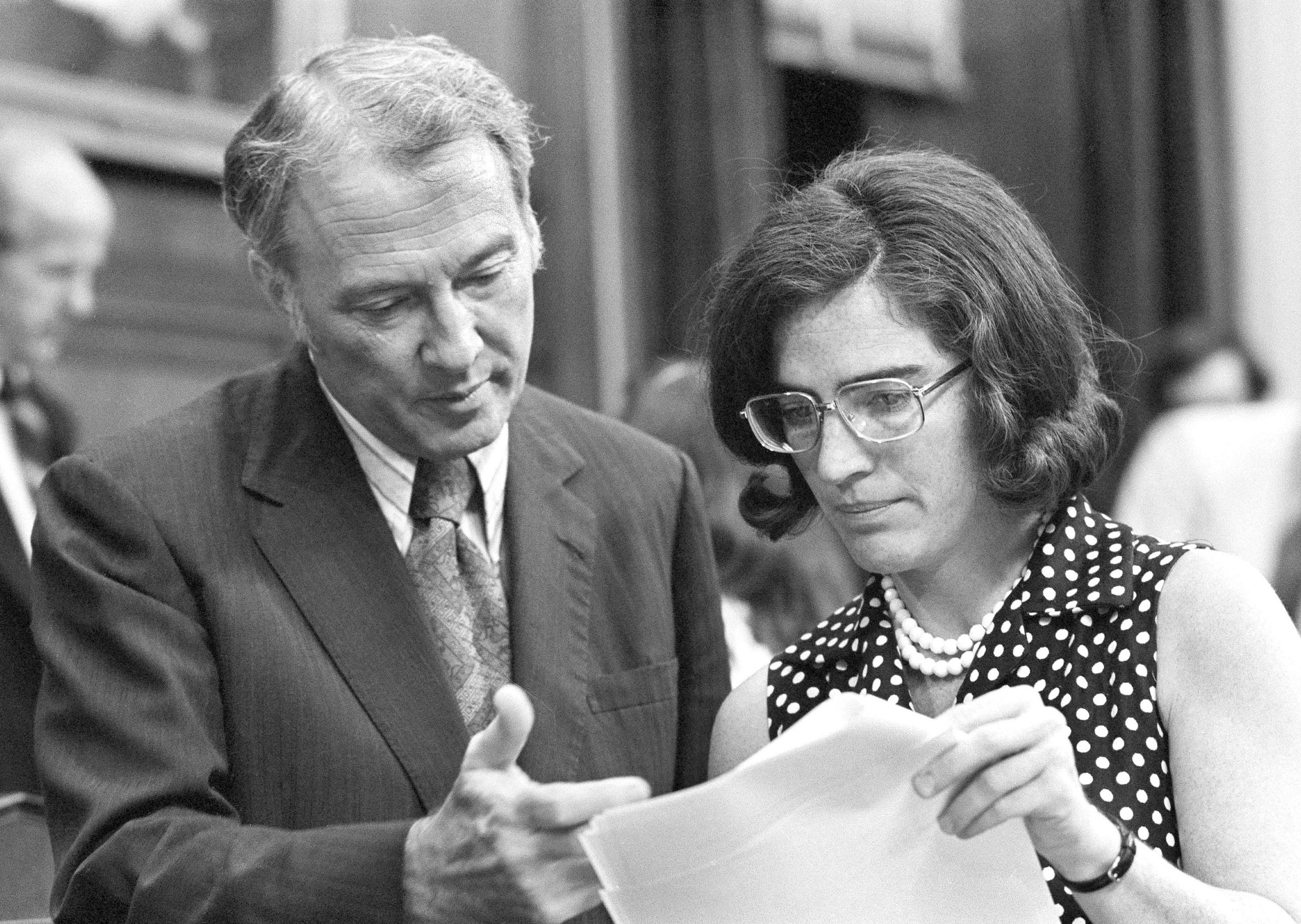 Rep. James Mann (D-SC) confers with Rep. Elizabeth Holtzman (D-NY) during a recess of the House Judiciary Committee's debate on articles of impeachment in Washington on July 29, 1974.