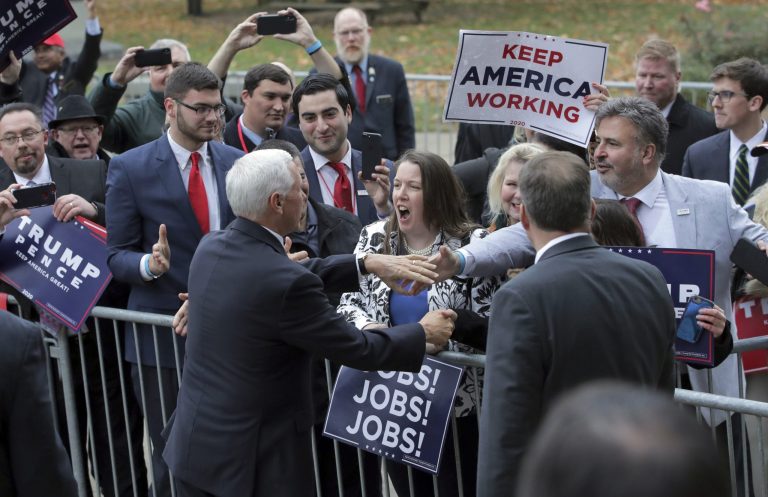Republican Vice President Mike Pence greets supporters as he leaves the New Hampshire State House after filing for President Donald Trump to be listed on the New Hampshire primary ballot, Thursday, Nov. 7, 2019, in Concord, N.H.