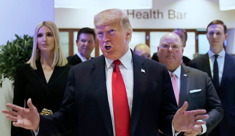 President Donald Trump reacts after addressing the World Economic Forum in Davos, Switzerland, Tuesday, Jan. 21, 2020. The 50th annual meeting of the forum will take place in Davos from Jan. 21 until Jan. 24, 2020. Left is Ivanka Trump and Jared Kushner is shown far right.