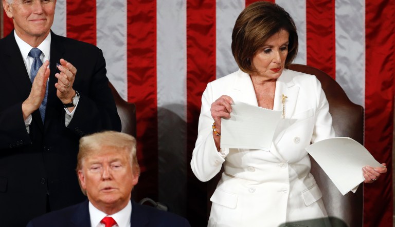 House Speaker Nancy Pelosi of Calif., tears her copy of President Donald Trump's s State of the Union address after he delivered it to a joint session of Congress on Capitol Hill in Washington, Tuesday, Feb. 4, 2020. Vice President Mike Pence is at left. 