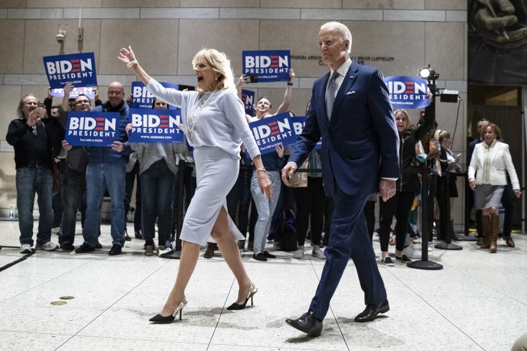 Democratic presidential candidate former Vice President Joe Biden, accompanied by his wife Jill arrives to speak to members of the press at the National Constitution Center in Philadelphia, Tuesday, March 10, 2020. 